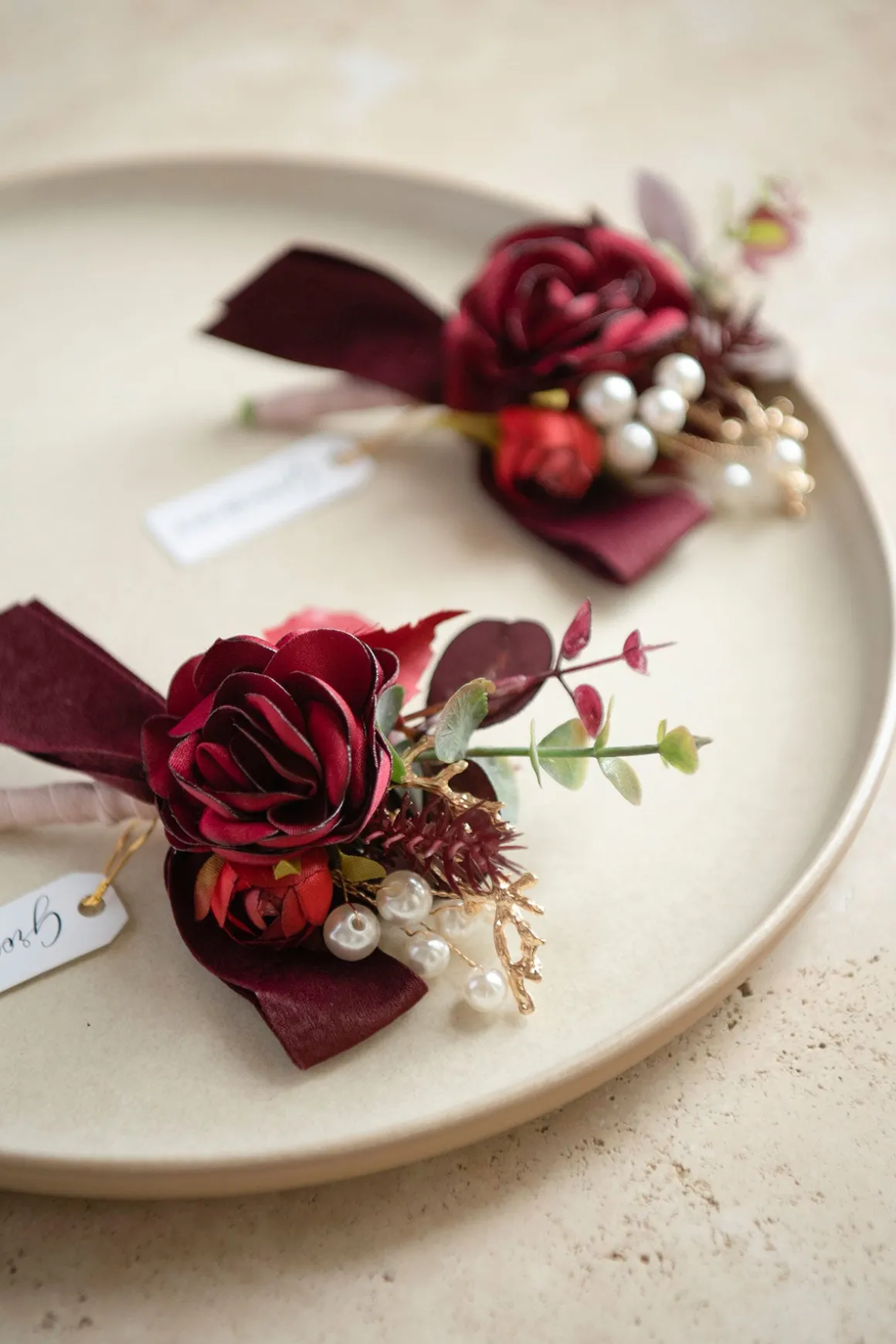 Boutonnieres in Burgundy & Dusty Rose