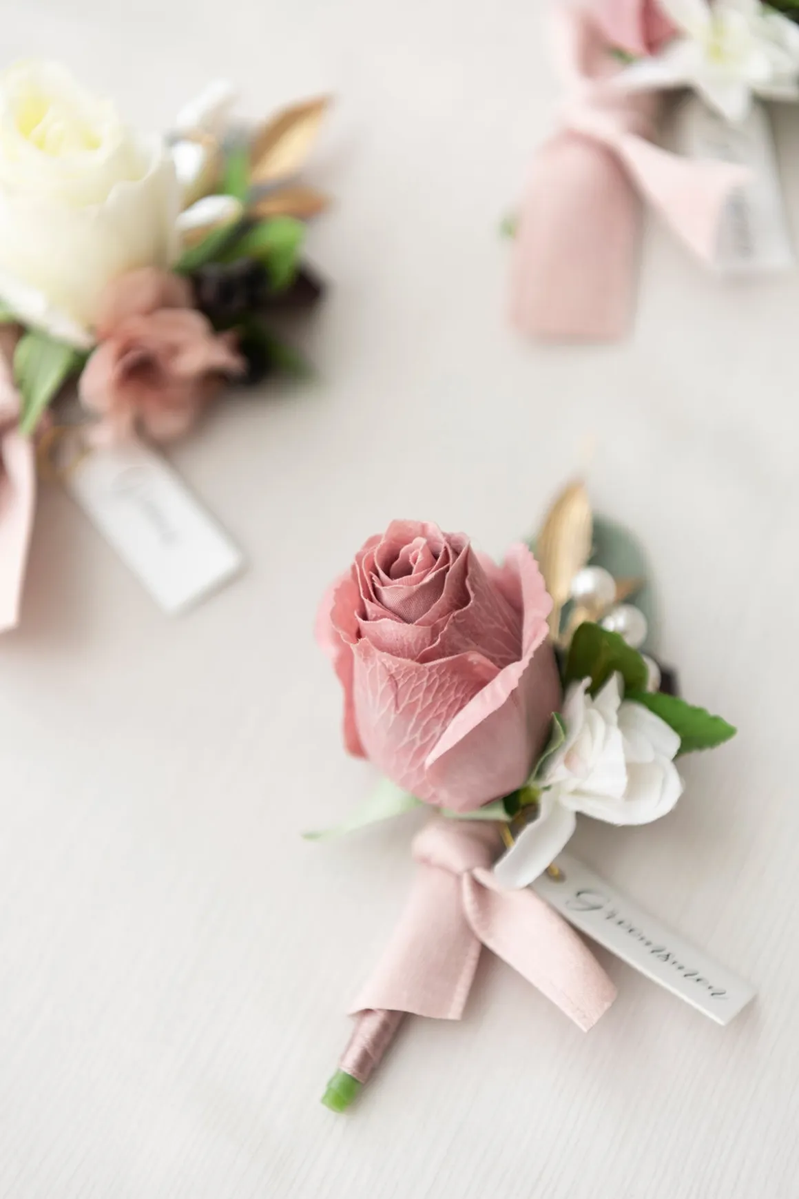 Boutonnieres in Dusty Rose & Mauve