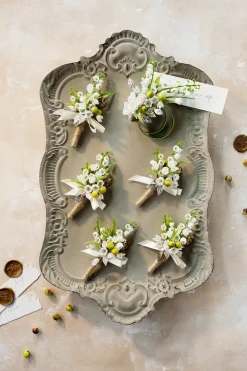 Boutonnieres in May Lily & Olive