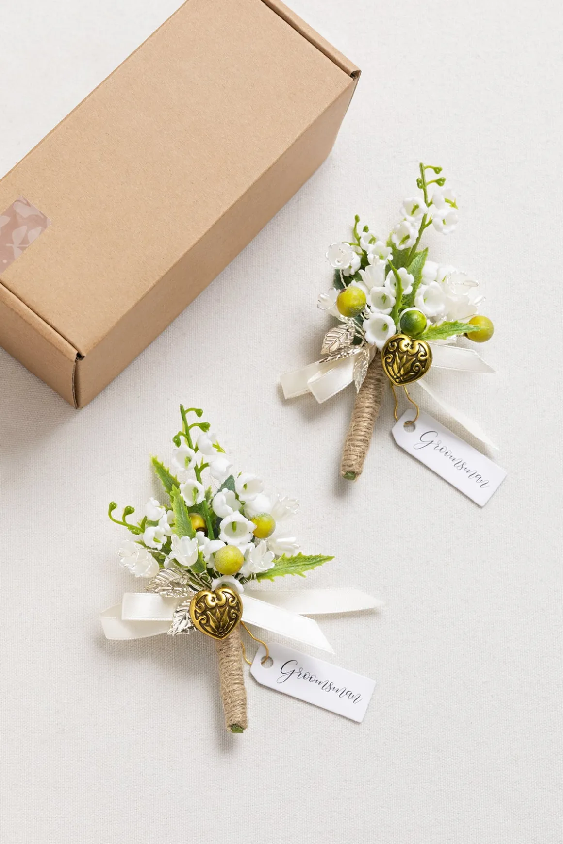 Boutonnieres in May Lily & Olive