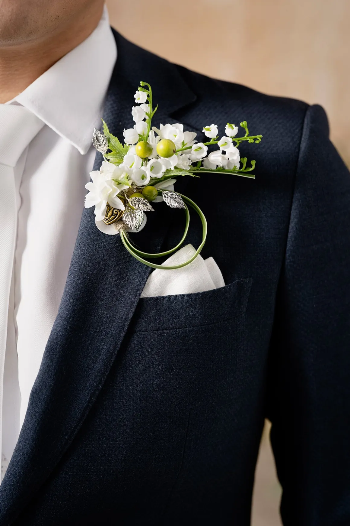 Boutonnieres in May Lily & Olive